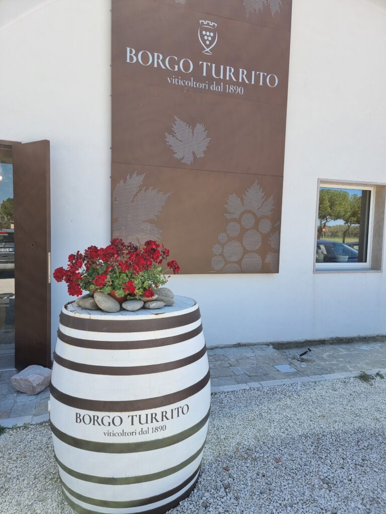 Wine Barrel and Sign on the Front Entrance Showing the winery name - Borgo Turrito